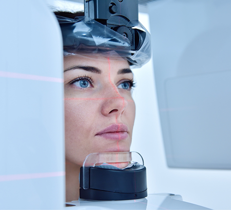 Dental patient getting a cone beam scan of her mouth and jaws