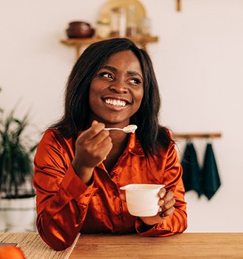woman eating yogurt