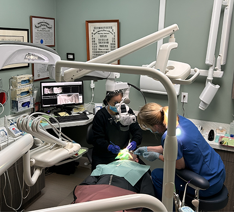 Dentist and assistant giving a patient a dental checkup in Winthrop