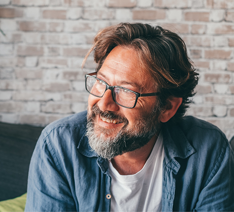 Smiling man in a denim shirt