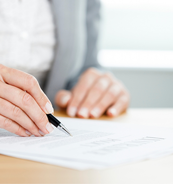 Person filling out paperwork