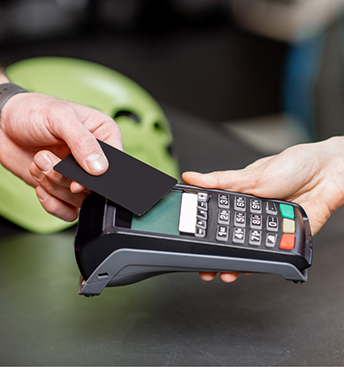 Person swiping their payment card