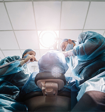 Dentist and assistant treating a patient