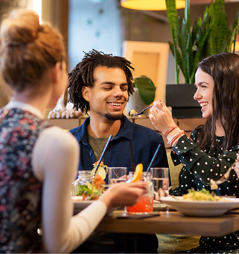 Group of people eating at a restaurant