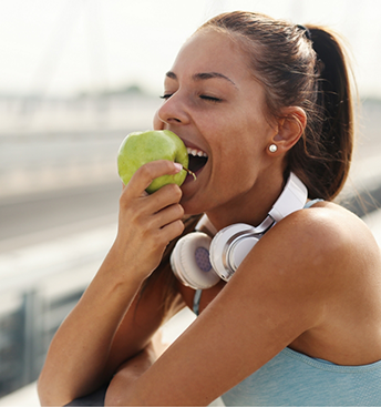 Woman eating an apple