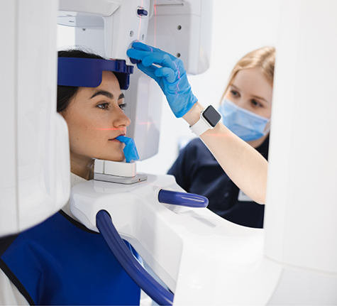 Dental patient getting a 3D cone beam scan of her mouth and jaws