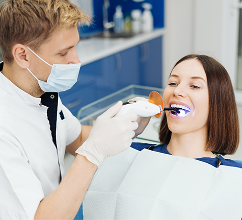 Dentist scanning a patient's teeth