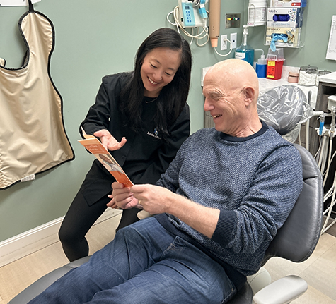 Winthrop emergency dentist taking notes while listening to a patient