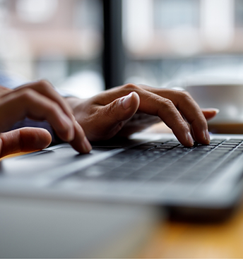 Person typing on a laptop