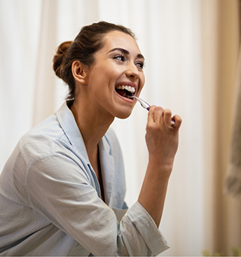 Woman brushing her teeth