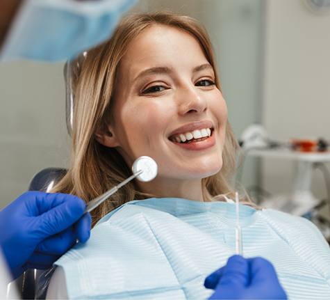 Woman smiling at a dental checkup