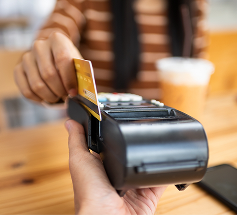 Person swiping their payment card