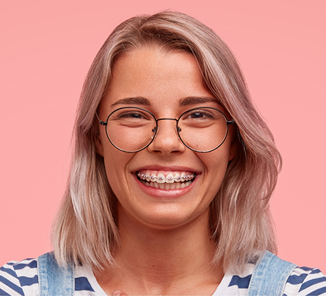 Smiling woman with traditional braces