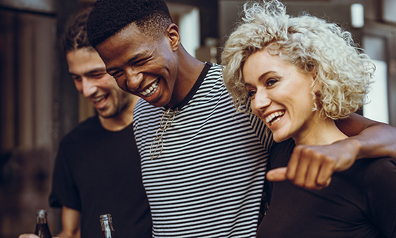 Three friends laughing together after receiving dental services in Winthrop