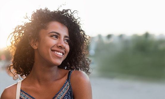 Young woman smiling in the sun