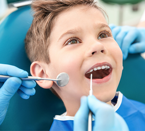 Young boy receiving a dental exam
