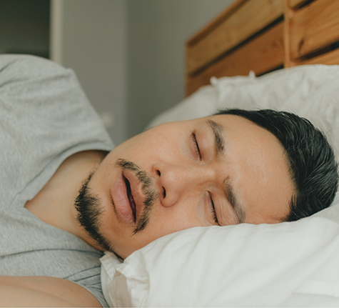 Man sleeping with his mouth open before sleep apnea treatment in Winthrop