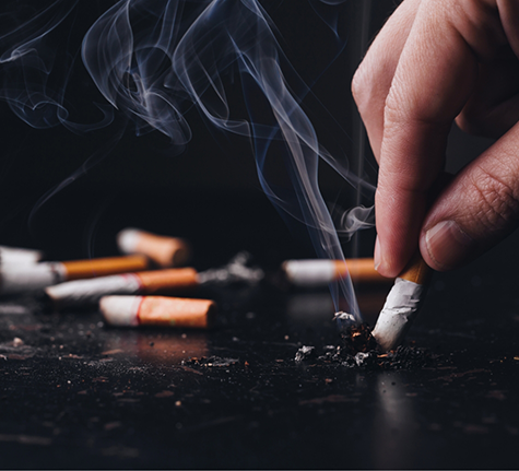 Person ashing their cigarette