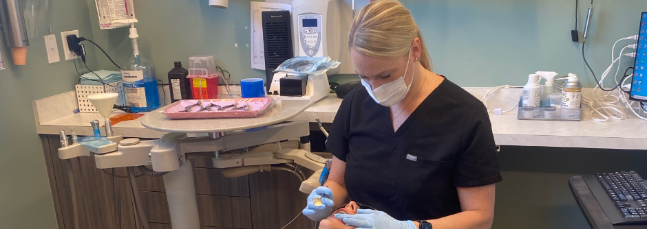 Dental team member treating a patient